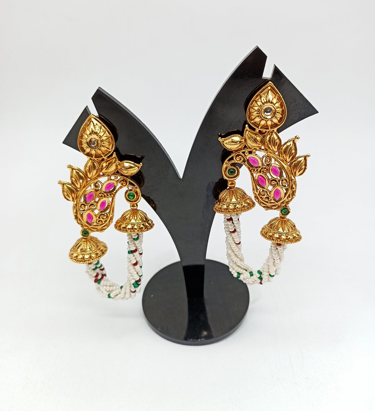 Gold Earrings With A Peacock Design